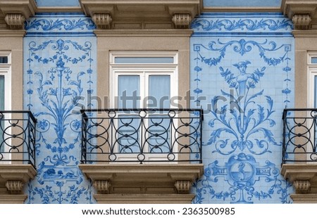 Renovated old building with beautifully painted tiles on the wall in Porto, Portugal