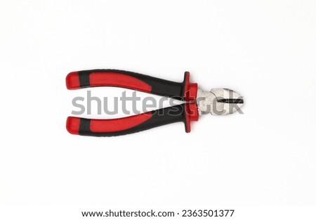 Wire cutting pliers, also known as diagonal cutting pliers or side cutters, are hand tools designed for cutting wires, cables, and small materials. They feature sharp, angled jaws. Royalty-Free Stock Photo #2363501377
