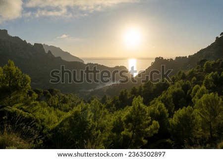 Beautiful view of Sun falling into the sea in Cala Tuent