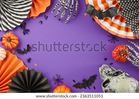 Crafting a memorable Halloween gathering filled with tricks and treats. Top view of skull, skeleton hands, pumpkins, colorful paper fans, spooky elements on violet background with advert area
