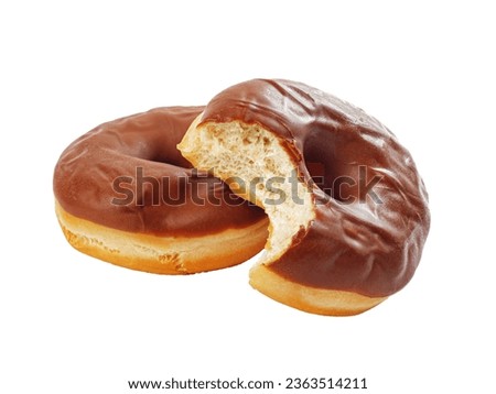 Chocolate glazed donut with a bite mark put on another donut, no shadows, studio shot isolated on white background Royalty-Free Stock Photo #2363514211