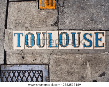 Toulouse Street Tiles set in sidewalk 