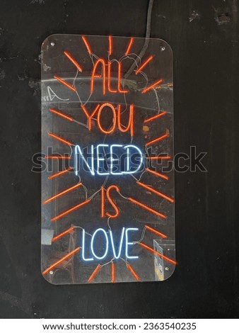 Neon Illuminated writings sign board different interesting different writings on the wall abstract pastel interesting surprising different background images digital light technology led buying now.