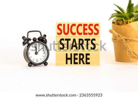 Success starts here symbol. Concept word Success starts here on beautiful wooden block. Black alarm clock. Beautiful white background. Business motivational success starts here concept. Copy space.
