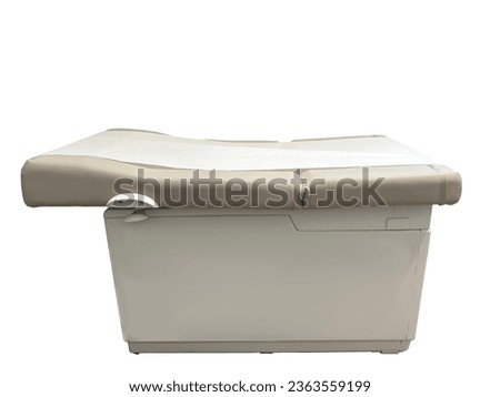 Physicians office medical exam table, isolated  Royalty-Free Stock Photo #2363559199