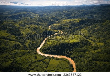 Rain forest and River in Costa Rica. High Angle drone picture. 