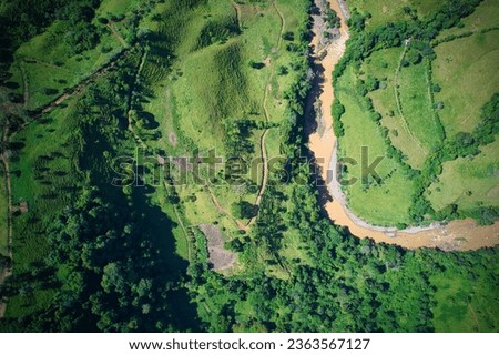 Rain forest and River in Costa Rica. High Angle drone picture. 