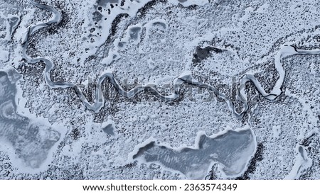 Frozen River At Ushuaia In Tierra Del Fuego Argentina. Snowy Mountains. Nature Landscape. Tierra Del Fuego Argentina. Lake Background. Frozen River At Ushuaia In Tierra Del Fuego Argentina.
 Royalty-Free Stock Photo #2363574349
