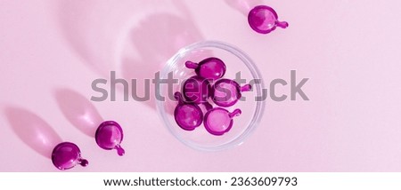 Health Supplements in Pink Pills, Vitamin Pills on a Pink Background