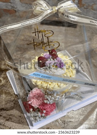 Happy birth day coconut cake in transparent cake box - a universal transparent box tube, Fluffy and Moist Coconut Cake Homemade. a piece of coconut cake on dish. Bakery picture free space for text.