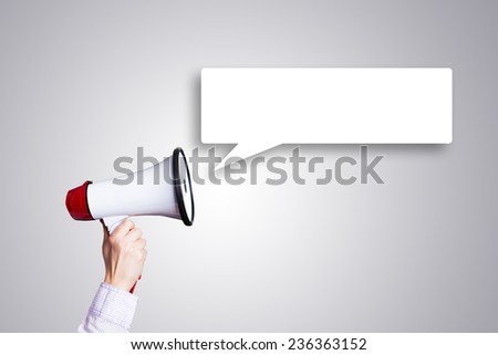 hand with a megaphone and an empty speechbubble Royalty-Free Stock Photo #236363152