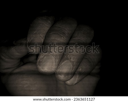 photo of a construction worker's rough hands black white