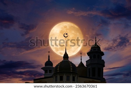 mosque's dome is considered an architecture of hope for Muslims and is an important Islamic landmark. Background to full moon and starry sky. Festive greeting card for the holy month Ramadan Kareem.