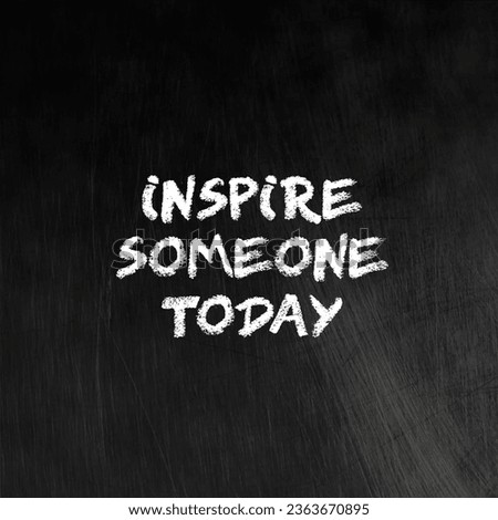 black board with the phrase inspire someone today written on it.