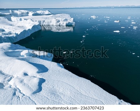 Greenland Ilulissat Icefjord Aerial View. Iceberg and glacier ice in Arctic nature landscape in Greenland. Ilulissat, Disko Bay, Baffin Sea, Greenland. 