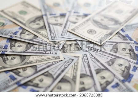 Background of a large number of new banknotes hundred dollars. Type acute angle Royalty-Free Stock Photo #2363723383