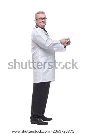 Full length portrait of male doctor using digital tablet isolated on white