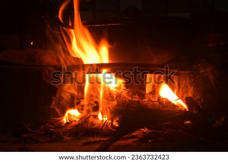 A beautiful picture of a fire burning in the fireplace