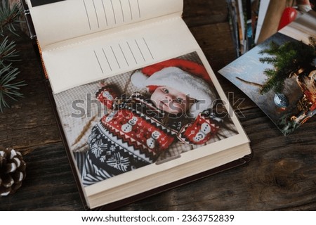 Christmas printed photos in picture album. Photo printing concept. 