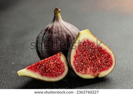 ripe figs. Tropical fruit on a dark background. organic healthy products.