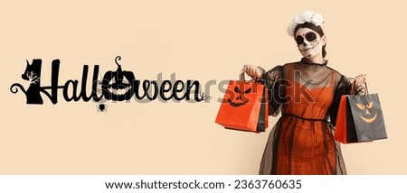Young woman in creepy costume and with shopping bags on beige background. Halloween celebration