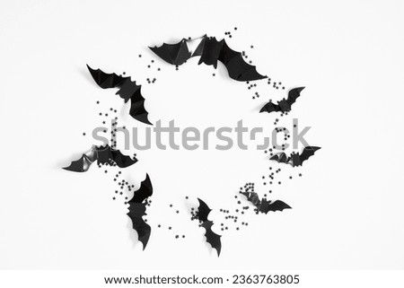 Halloween decorations concept. Black bats cut from paper on white background. Halloween decor and decorations for  holiday