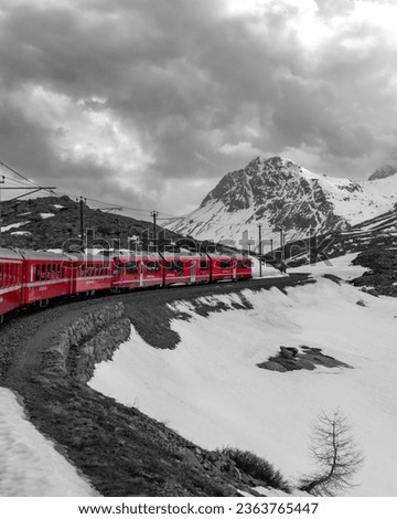 Artistic picture of Bernina Express train in the alpine landscape