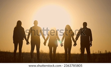 teamwork. team community holding hands together silhouette at unity sunset. group of people hands. teamwork of workers. team in lifestyle the company running partnership business community hand Royalty-Free Stock Photo #2363785805