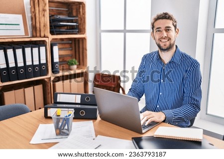 Young man business worker using laptop working at office