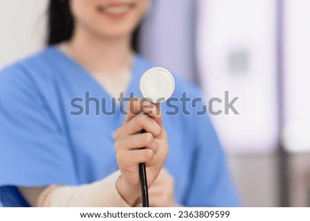 Medical doctor with stethoscope at hospital, Asian female doctor, Healthcare and medical service concept.