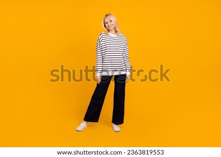 Photo of pretty lovely grandmother lady standing try fit new clothes in modern boutique isolated bright color background