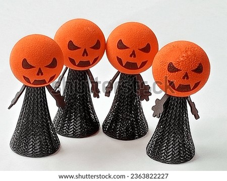 Four pumpkins are standing on a white background.