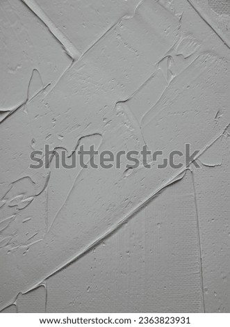 white paint on a wall as a background, closeup of photo