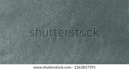 Dark grey felt material. Surface of felted fabric texture abstract background in black gray color.