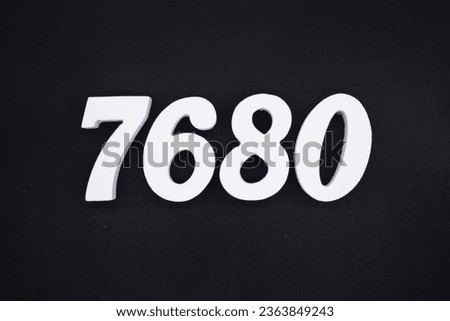 Black for the background. The number 7680 is made of white painted wood.