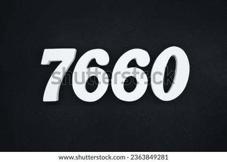 Black for the background. The number 7660 is made of white painted wood.