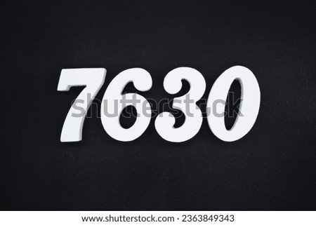 Black for the background. The number 7630 is made of white painted wood.