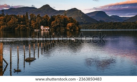Sunrise over becalmed Derwent Water Royalty-Free Stock Photo #2363850483