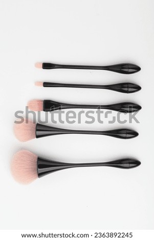 Makeup brushes
Cosmetic applicators
Beauty tools
Brush set
Makeup artist essentials
Precision application
Cosmetic bristles
Foundation blending
Eye shadow brushes
Professional makeup brushes Royalty-Free Stock Photo #2363892245