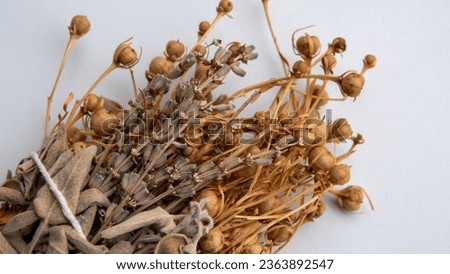 Picture of herbal incense made with herbs such as lavender and sage on a white background. Copy space