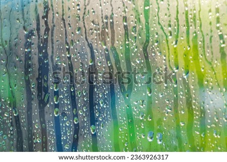 Bokeh photo through a glass window on a rainy day