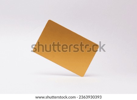 Gold business card or credit card mockup levitating on white background