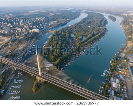 View of Ada Ciganlija from aerial drone and Most na Adi bridge over Sava River. Belgrade - Serbia Royalty-Free Stock Photo #2363936979