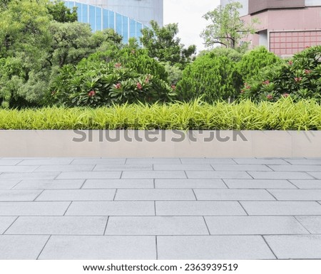 Garden, beautifully trimmed shrubs gray tile floor Multipurpose yard Suitable for a walk or picnic.