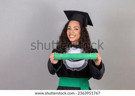 Educational theme: graduating student girl in an academic gown. Isolated over white background.