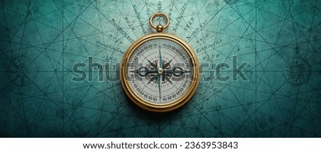 Magnetic old compass on world map. Travel, geography, history, navigation, tourism and exploration concept background. Retro compass on geography map. Royalty-Free Stock Photo #2363953843