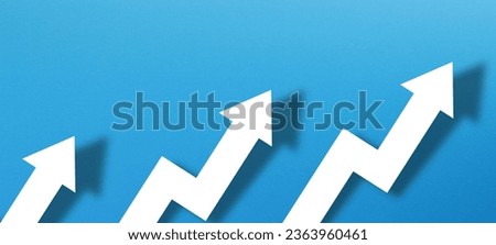 Business development and growth concept with white paper arrow on blue background