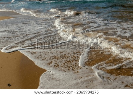 waves in a beach in Galicia, Spain, at sunset