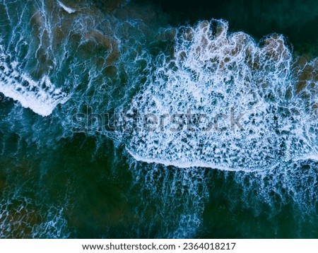 Aerial view of Big Waves crashing in the ocean,Sea surface ocean waves background,Top view waves background
