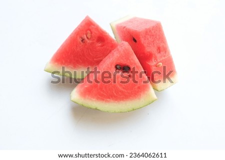 slice ripe juicy red watermelon (citrullus lanatus) triangles isolate on white backdrop.top view and flat lay.healthy summer food and fruit ideas